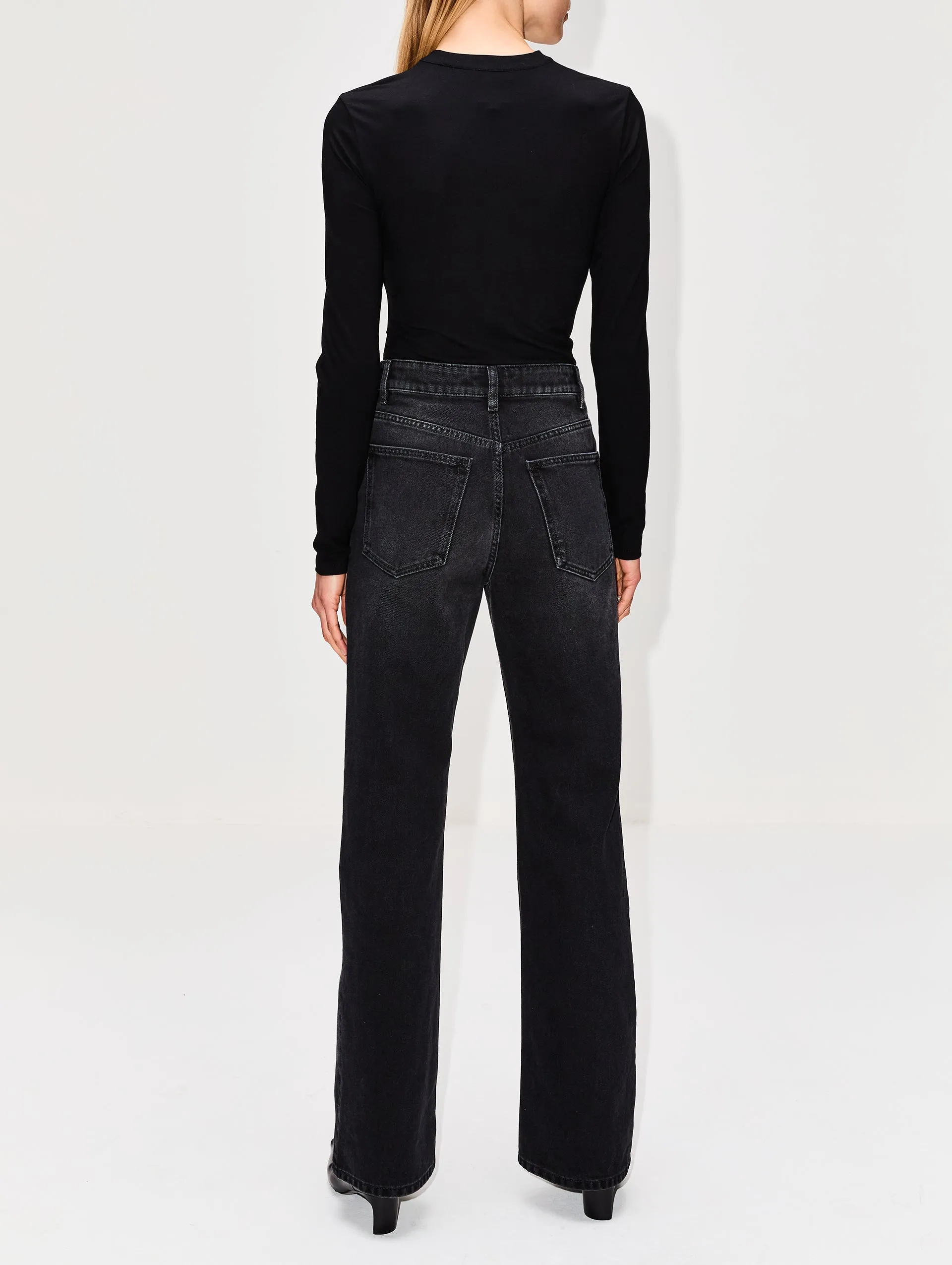 High-rise waist jeans with detailed embellishments.