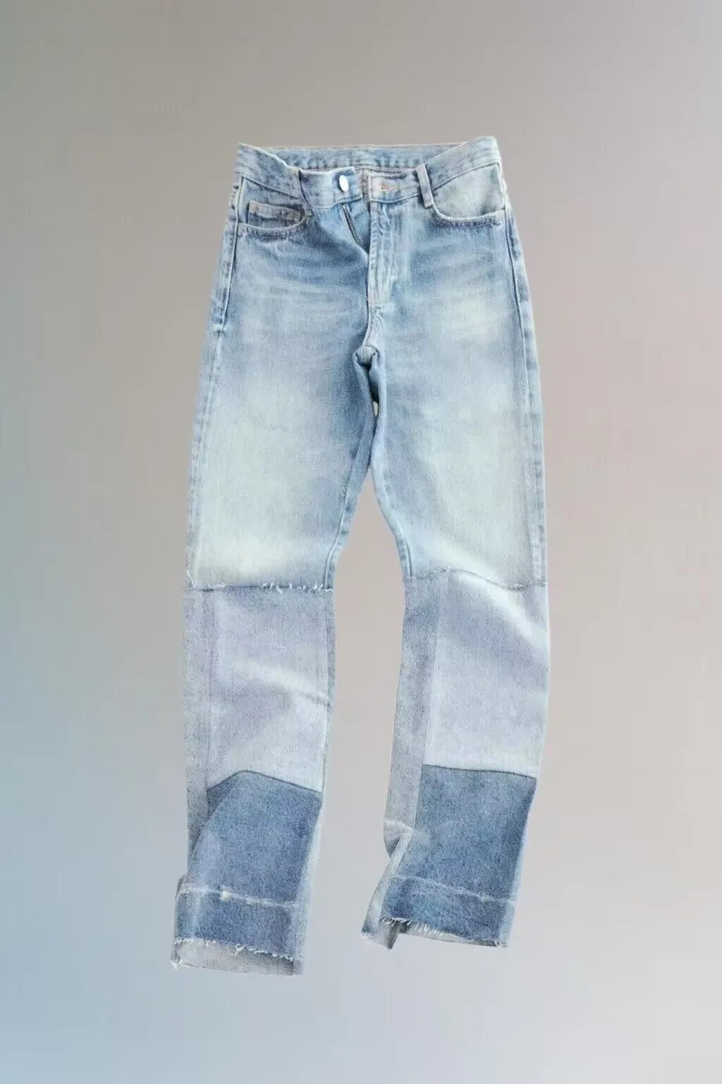 Low rise asymmetrical patchwork denim jeans